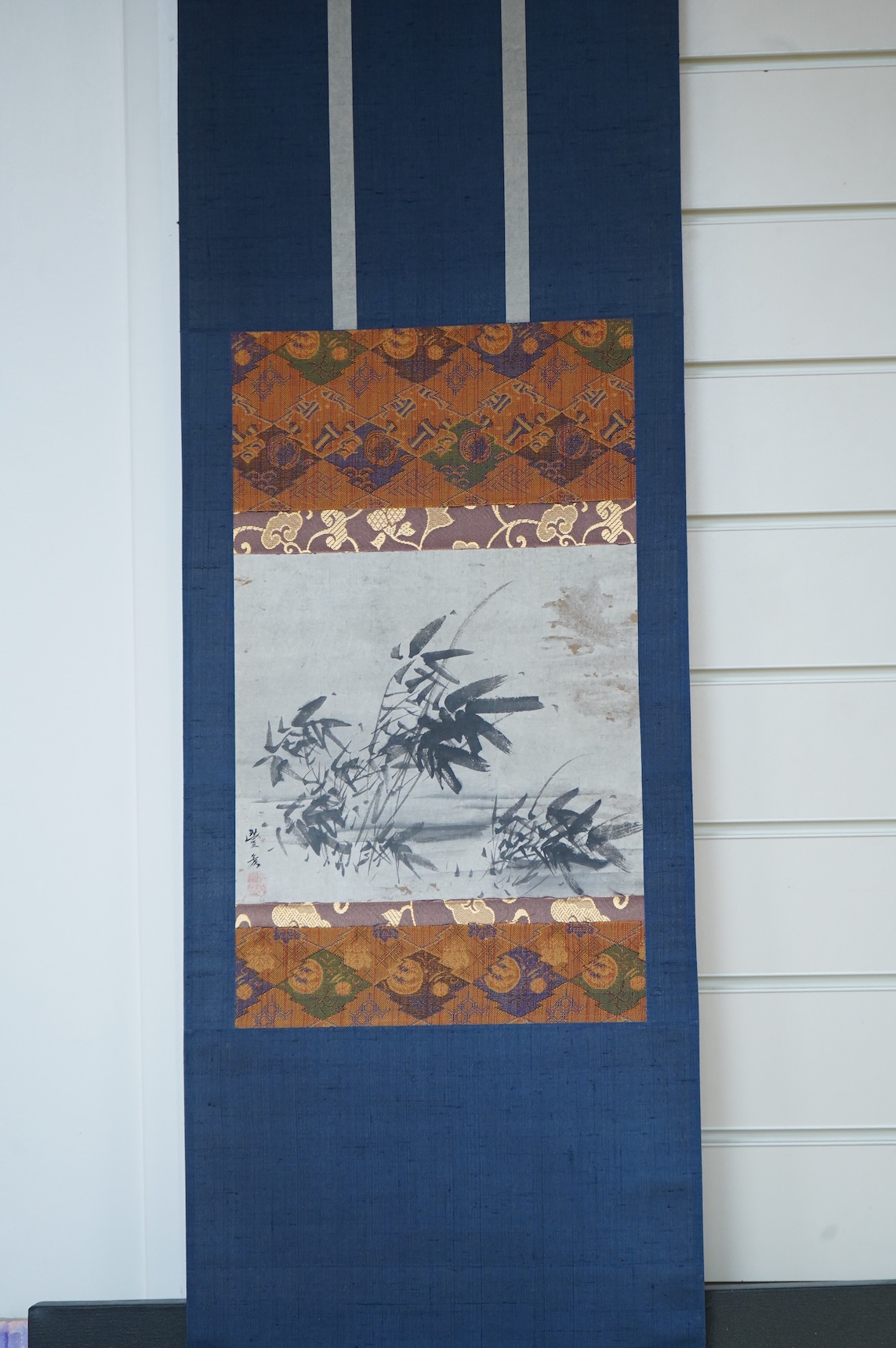 Four Japanese scrolls, to include a monochrome study of birds amongst lily pads, each boxed